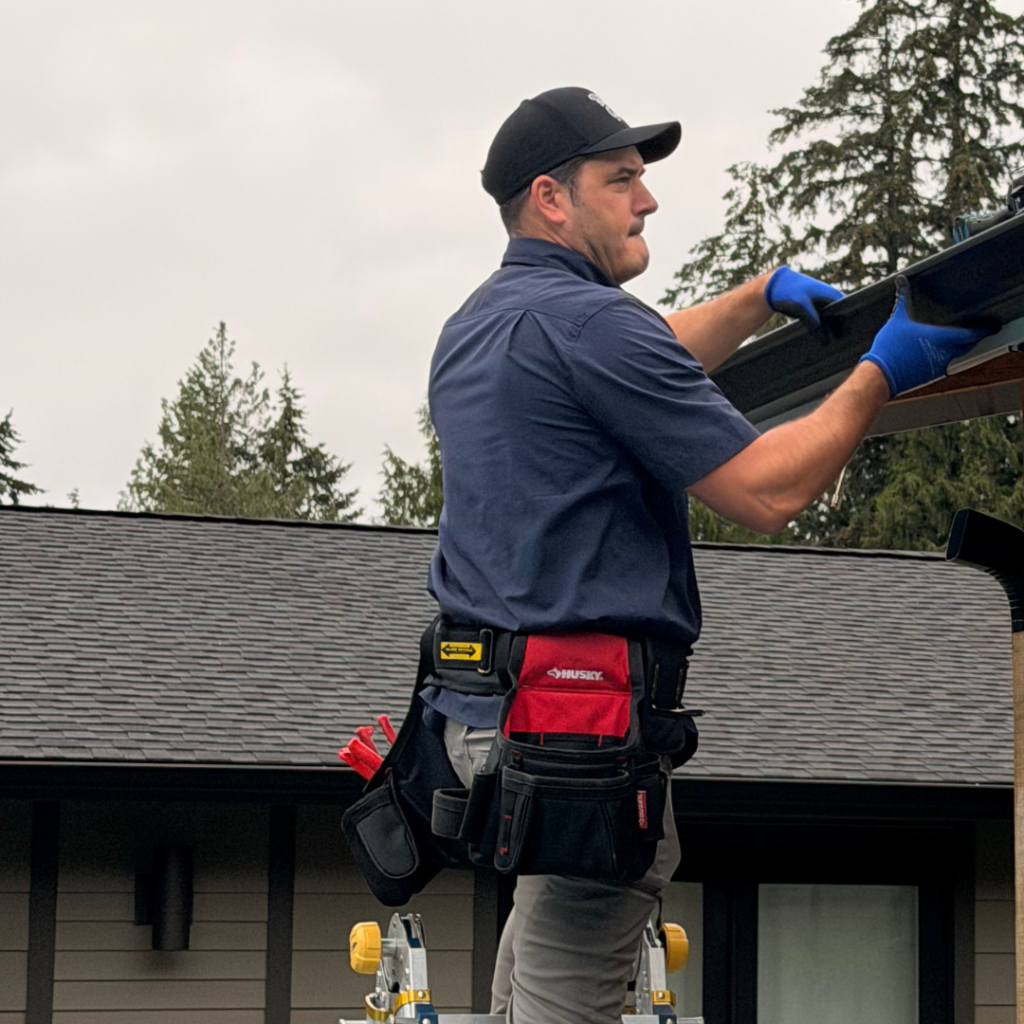 Two Solutionists setting a seamless run on a South Sound home