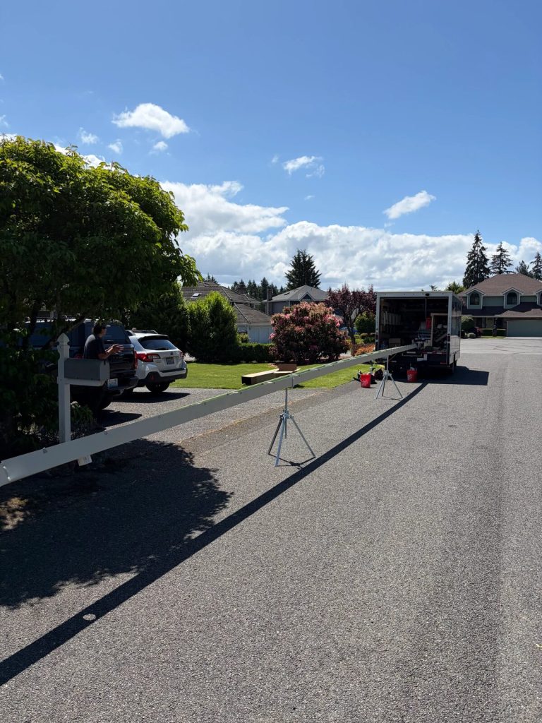 The Brothers That Just Do Gutters truck and gutter machine on a South Sound street