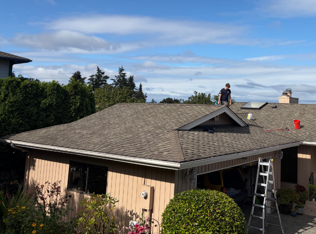 Crew working a roofline on a Tacoma area home